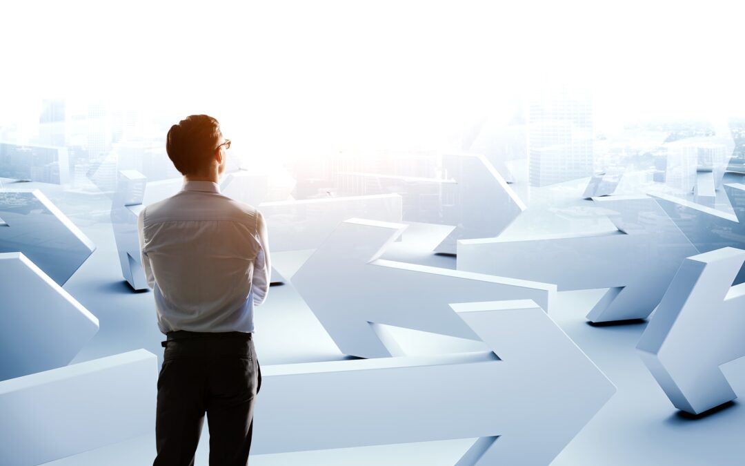 Young businessman and lots of arrows with different directions. Mixed media